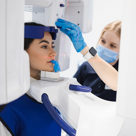 Womn getting a scan of her mouth and jaws