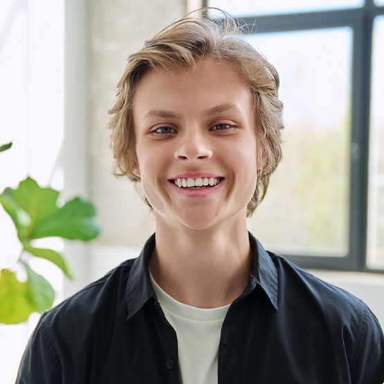 Smiling blonde teenage boy