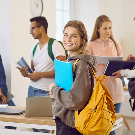 Smiling teenage girl in a classroom