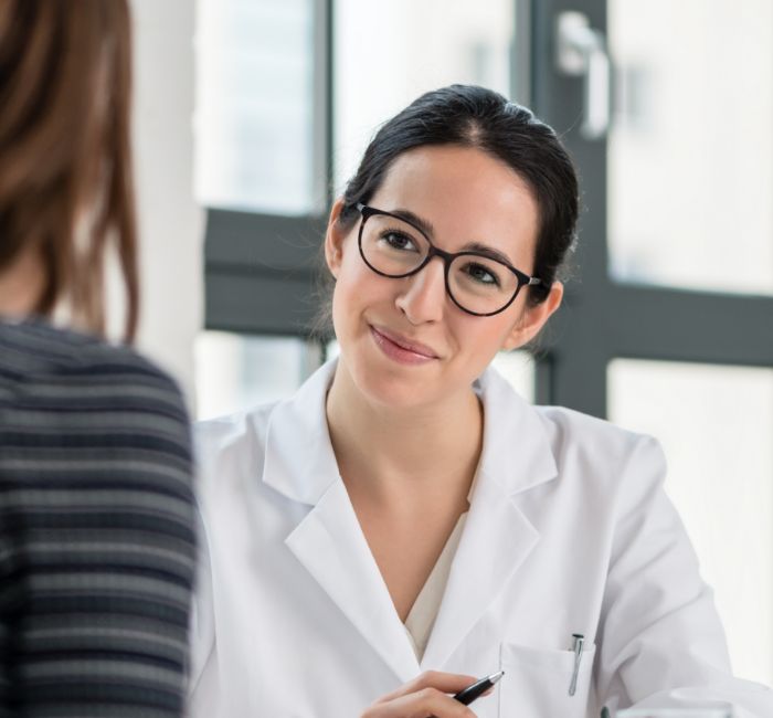 Orthodontist listening to a patient