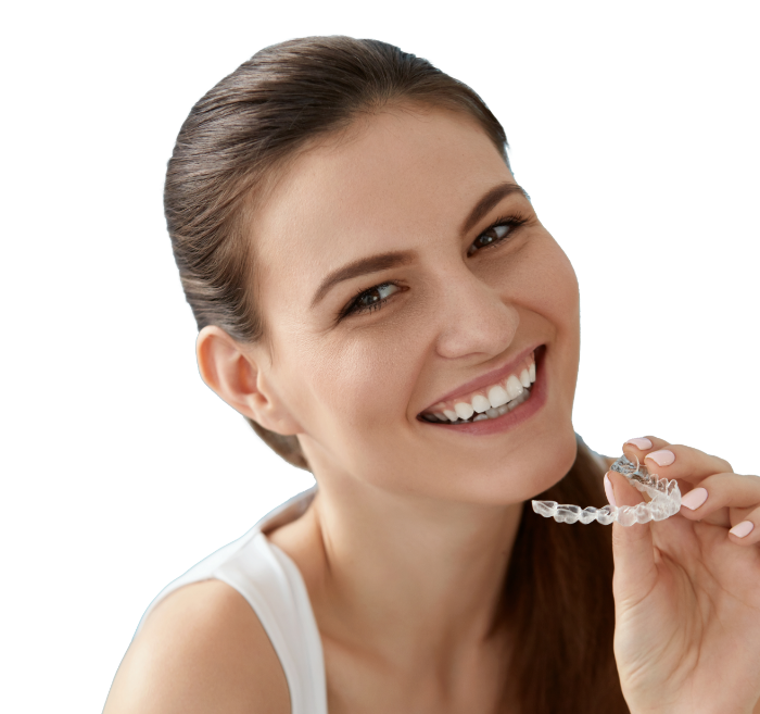 Young woman holding a clear aligner