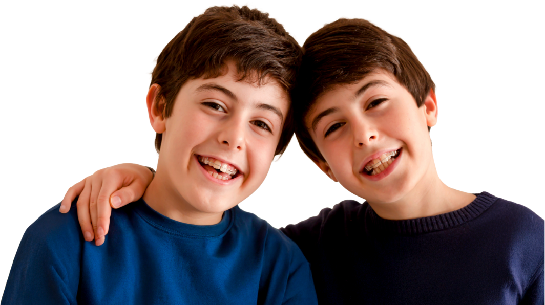 Two boys smiling with archwires on their teeth