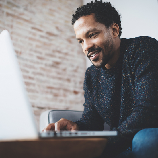 Man using a laptop at a table