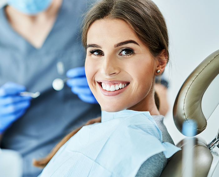 Smiling woman visiting her orthodontist in Columbus