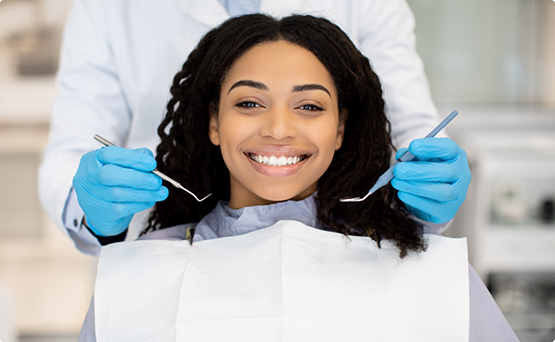 Woman grinning during a dental checkup