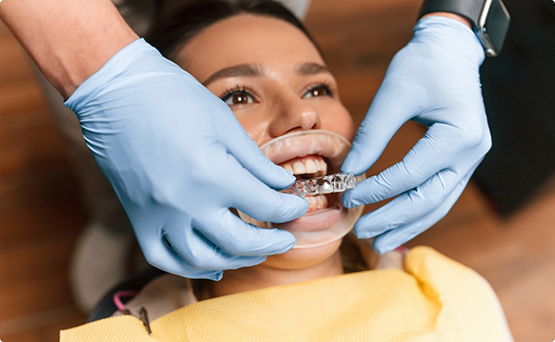 Woman being fitted for Invisalign